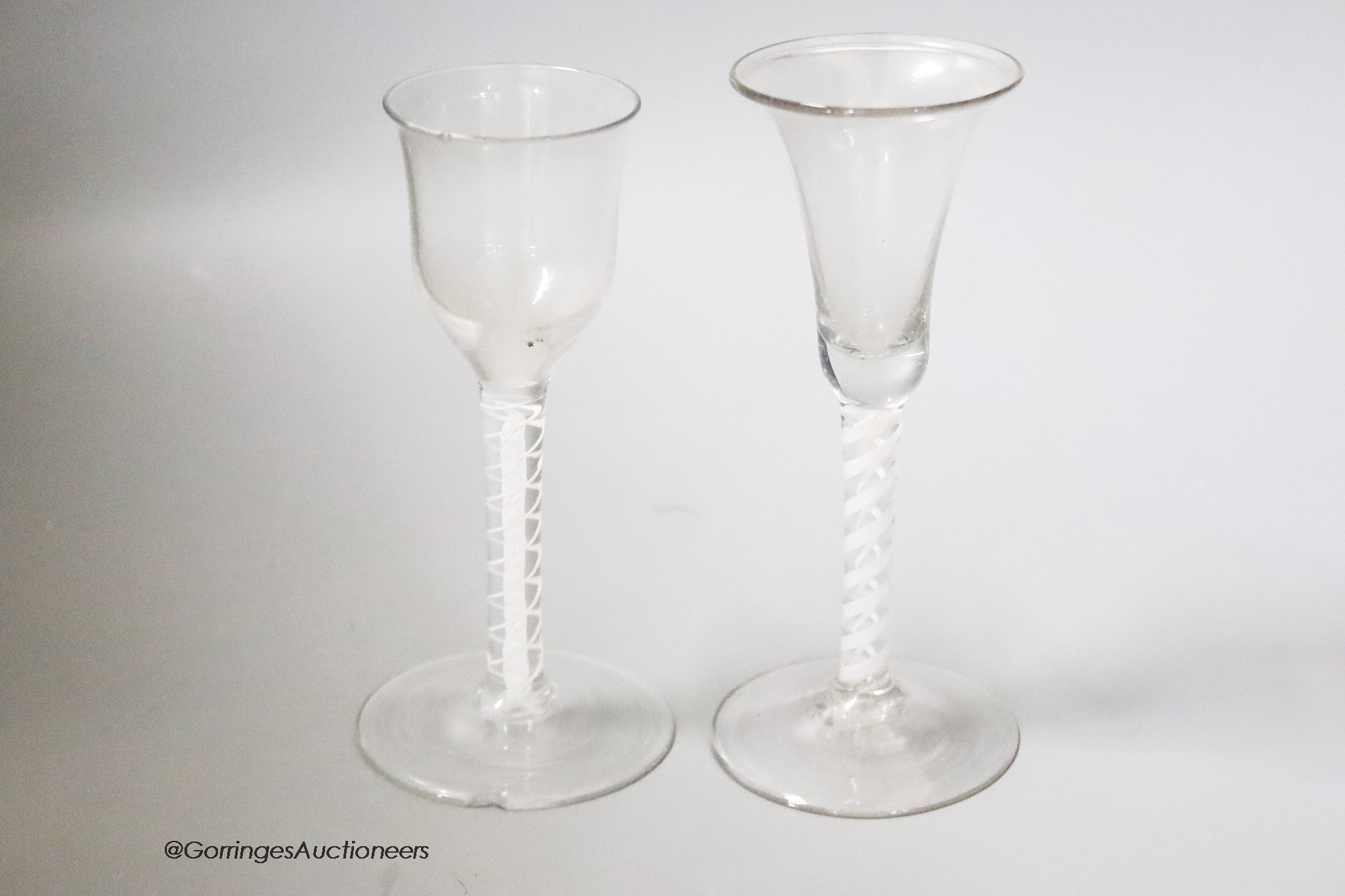 Two 18th century cotton twist stemmed wine glasses, tallest 15.5cm, one wth a rim chip